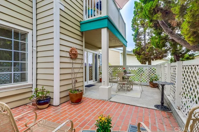 a view of a chairs and table in the patio