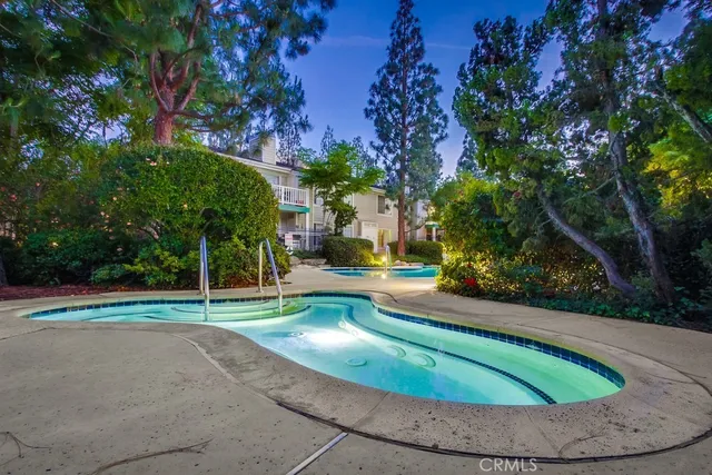 a view of a park with large trees