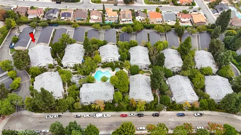 a picture of street with lots of flowers and buildings