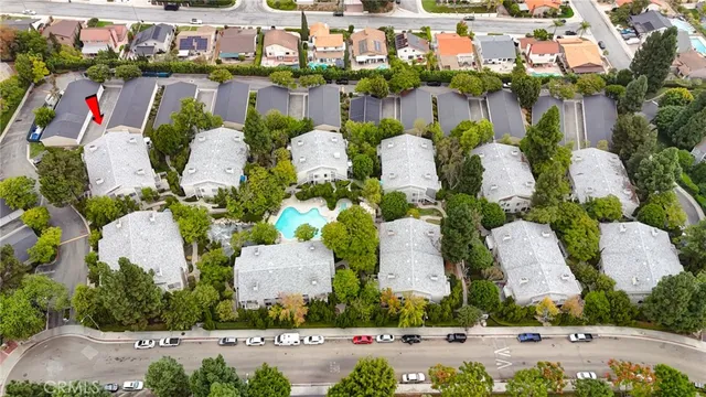 a picture of street with lots of flowers and buildings