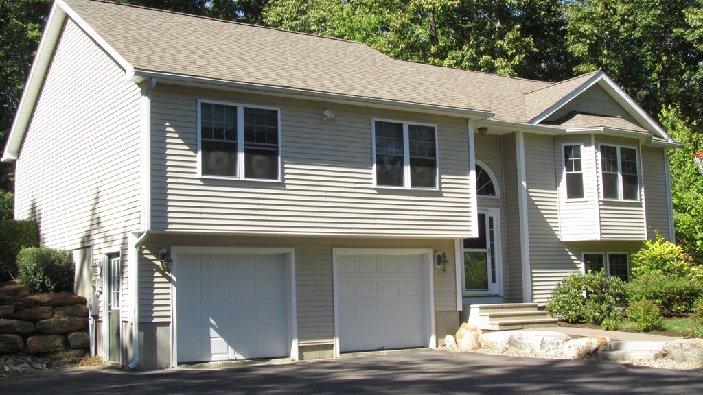 194 Turkey Hill Road Rutland, MA 01543 - Photo 1 of 20 a front view of a house with a garage