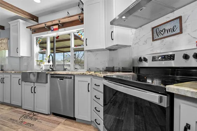 a bed room with a bed and a television