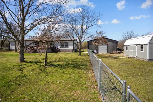 a view of swimming pool with a yard