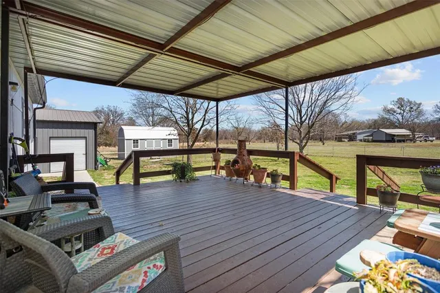 a view of a chairs and table in the patio