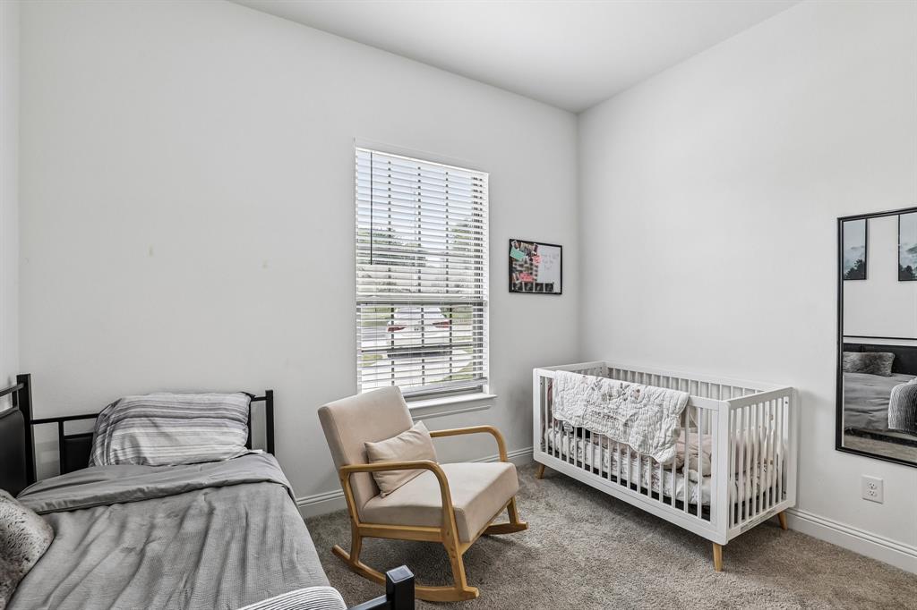 515 West Laureland Road Dallas, TX 75232 - Photo 14 of 32 a bedroom with a bed and a window