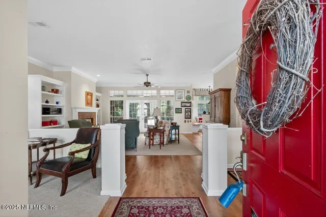 a view of living room with furniture and a chandelier