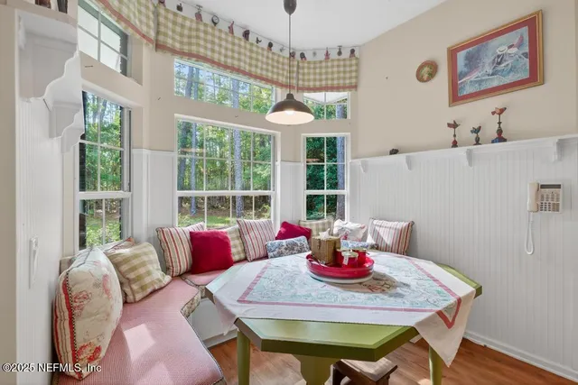 a view of living room with furniture and windows