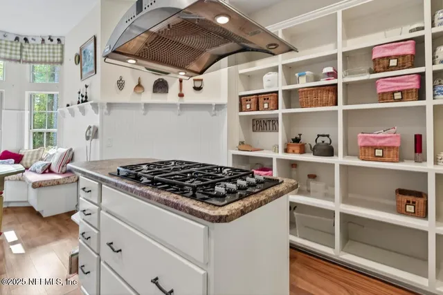a bed room with a bed and a chandelier