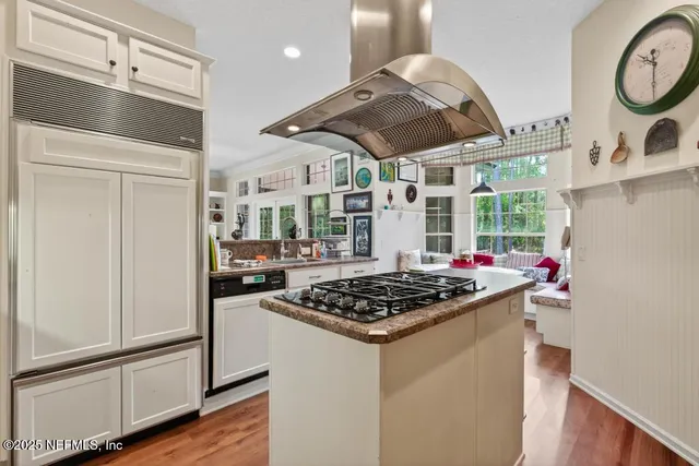 a bedroom with 2 bed and a chandelier