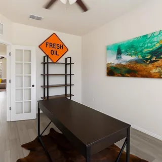 a view of a hallway with seating area