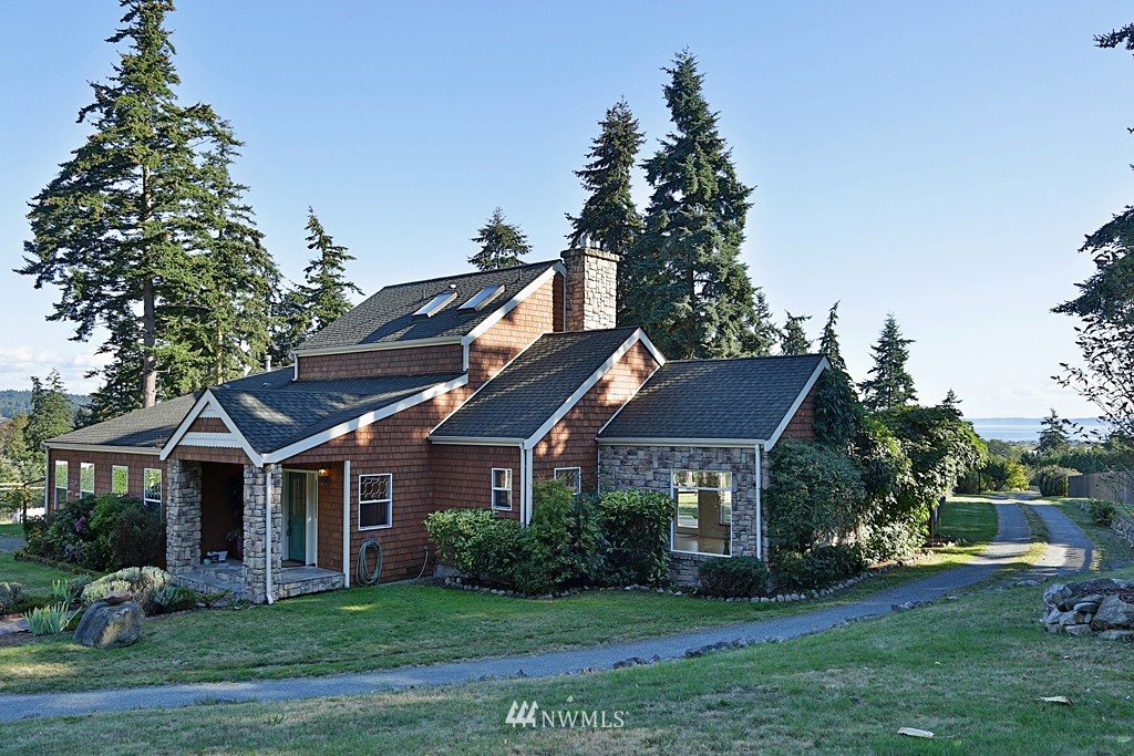 5723 Crow Haven Road Langley, WA 98260 - Photo 1 of 25 a front view of a house with a garden