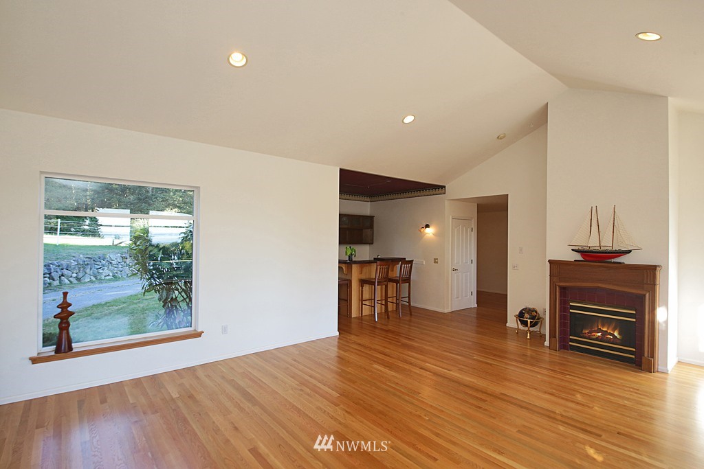 5723 Crow Haven Road Langley, WA 98260 - Photo 9 of 25 a view of a livingroom with furniture and a fireplace