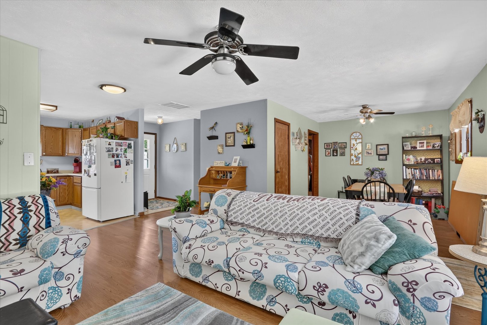 1204 West Violet Street Freeport, IL 61032 - Photo 7 of 36 a bedroom with a bed ceiling fan and a window