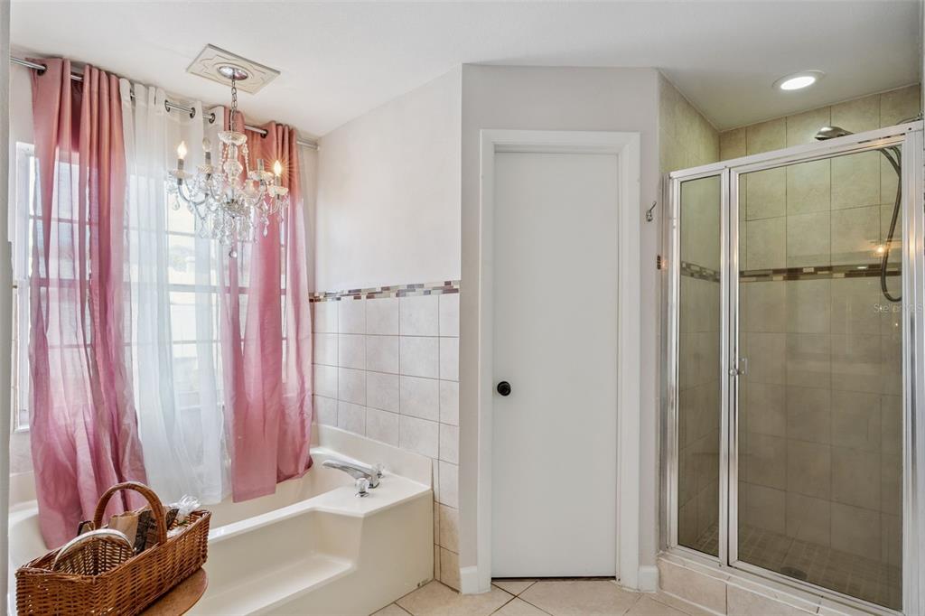 1070 Hali Ridge Court Kissimmee, FL 34747 - Photo 11 of 36 a bathroom with a shower curtain and a sink