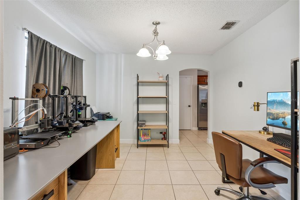 1070 Hali Ridge Court Kissimmee, FL 34747 - Photo 16 of 36 a room with cabinets and wooden floor