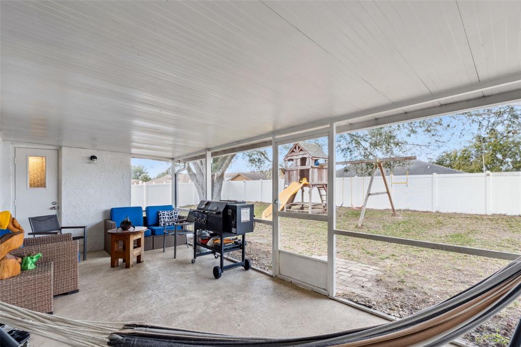 1070 Hali Ridge Court Kissimmee, FL 34747 - Photo 17 of 36 a living room with furniture and a large window