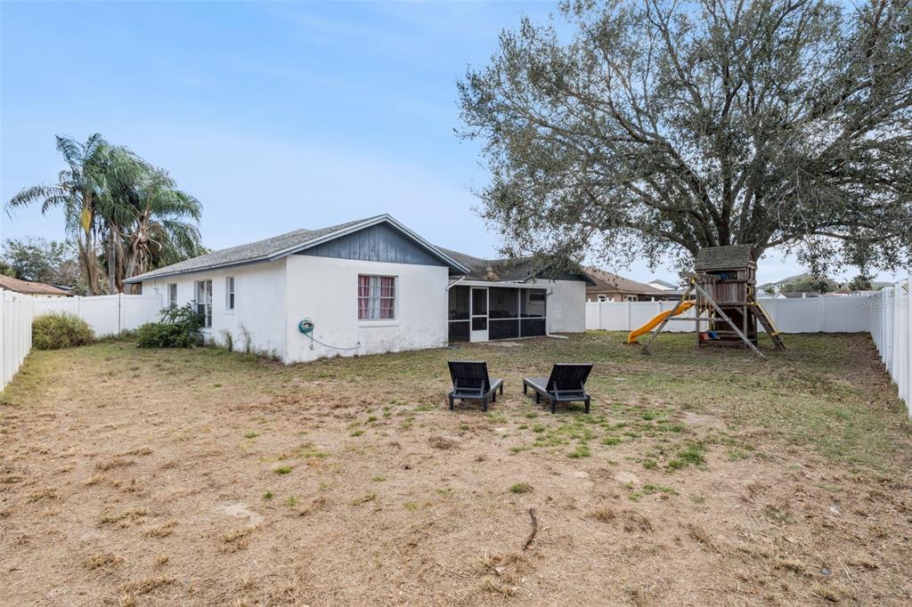 1070 Hali Ridge Court Kissimmee, FL 34747 - Photo 19 of 36 a front view of a house with garden