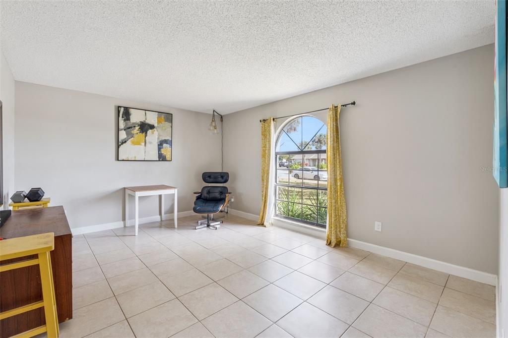 1070 Hali Ridge Court Kissimmee, FL 34747 - Photo 3 of 36 a view of room with lounge chair and a window