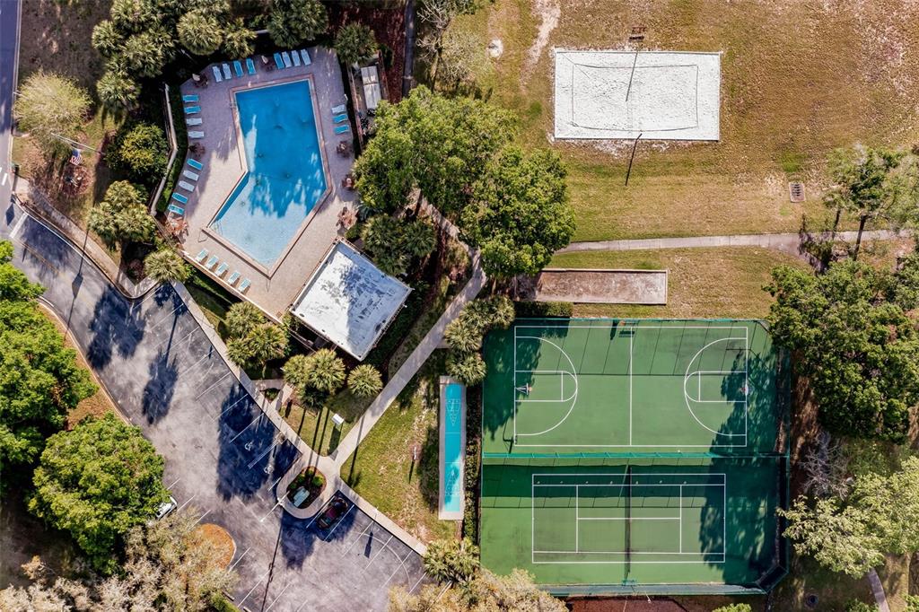 1070 Hali Ridge Court Kissimmee, FL 34747 - Photo 34 of 36 a green building with trees in front of it