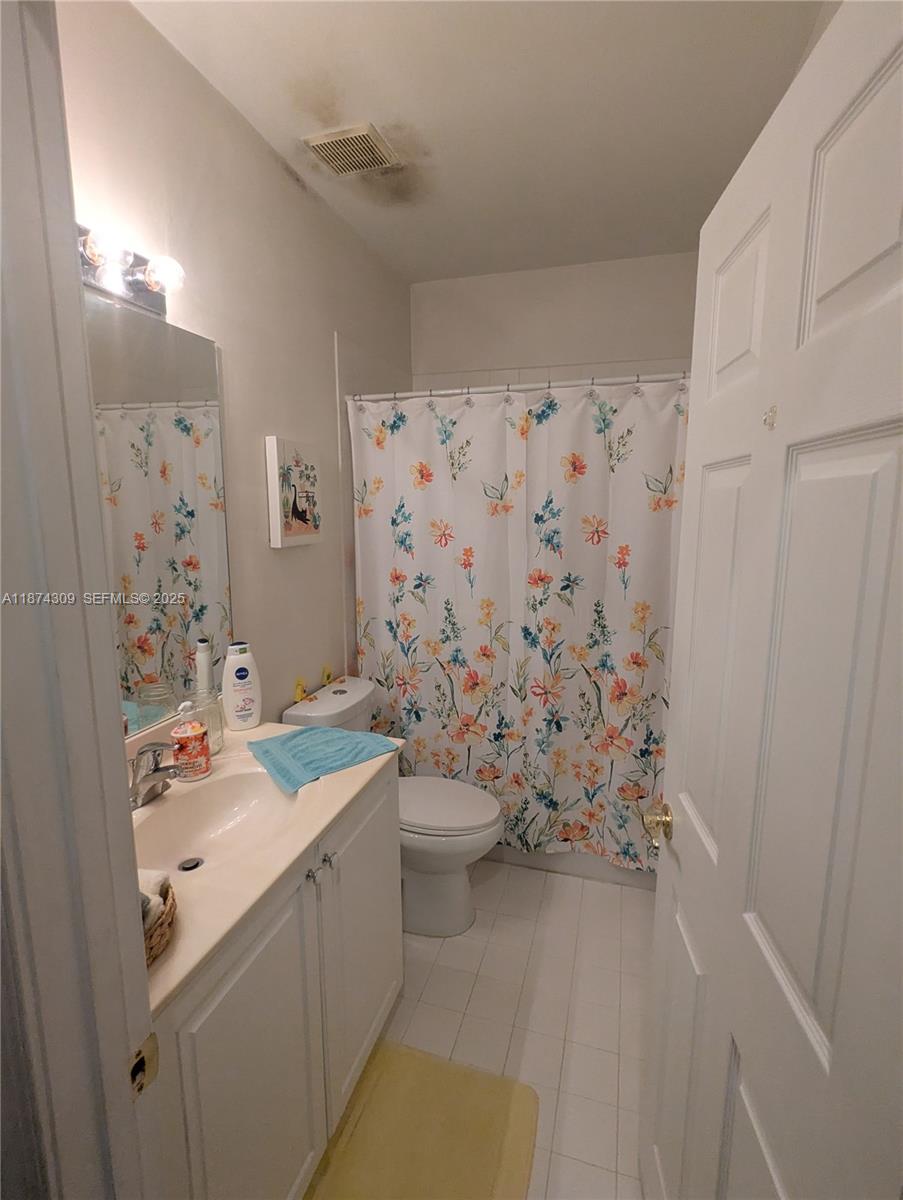 8496 Southwest 29th Street, Unit 104 Miramar, FL 33025 - Photo 14 of 19 a bathroom with a sink toilet and shower