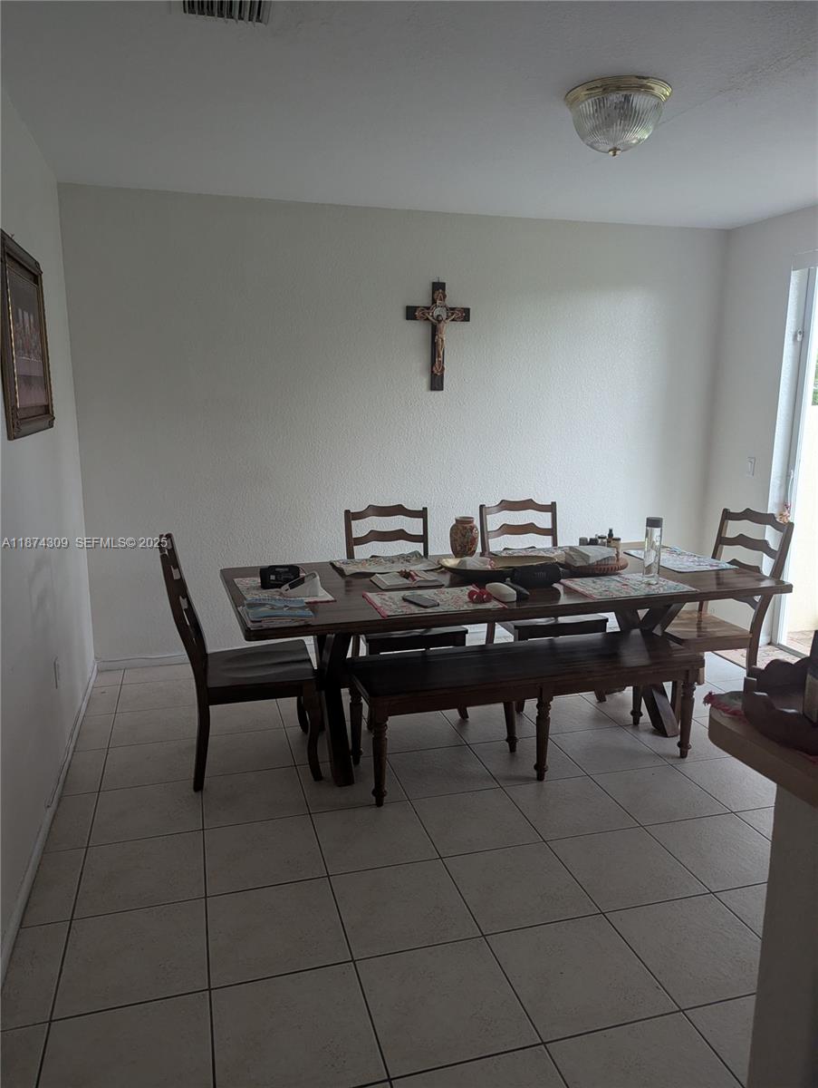 8496 Southwest 29th Street, Unit 104 Miramar, FL 33025 - Photo 6 of 19 a view of a tables and chairs in a room