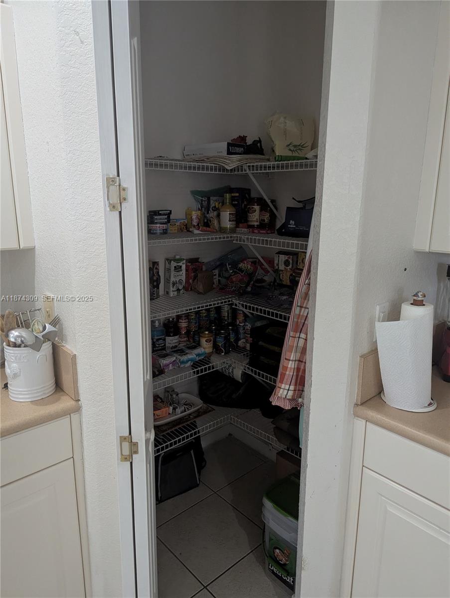 8496 Southwest 29th Street, Unit 104 Miramar, FL 33025 - Photo 9 of 19 a room with storage and utility