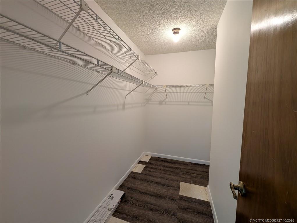 8291 Southeast Croft Circle, Unit M8 Hobe Sound, FL 33455 - Photo 15 of 22 a view of room with racks on the wall