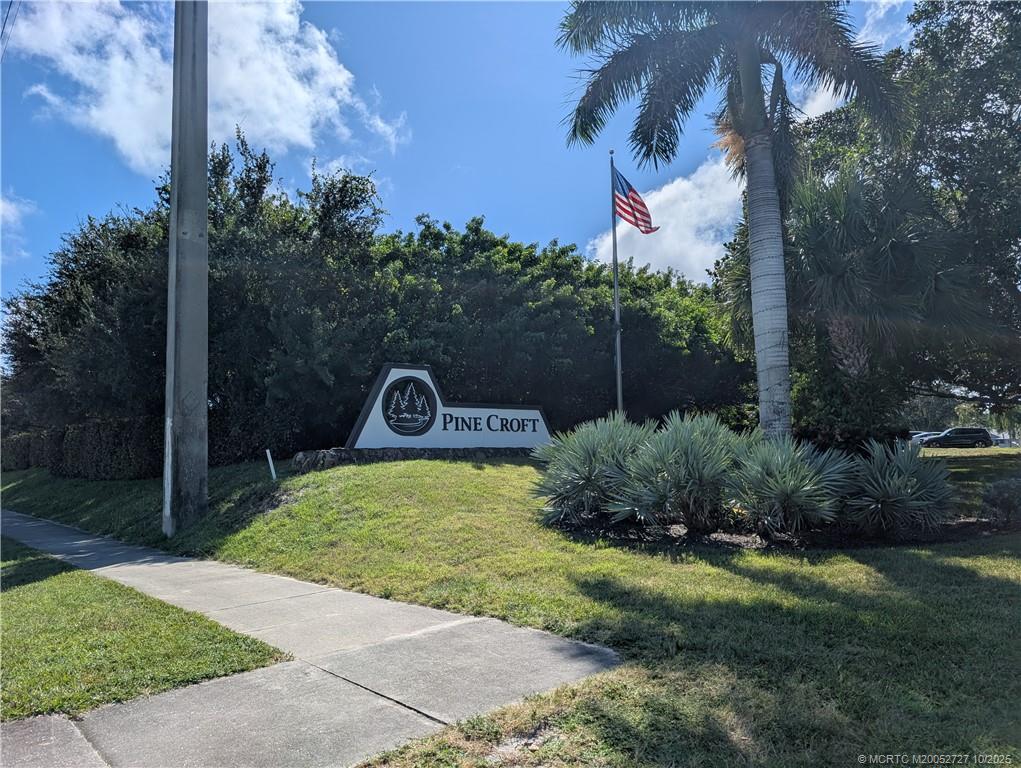 8291 Southeast Croft Circle, Unit M8 Hobe Sound, FL 33455 - Photo 21 of 22 a view of a back yard