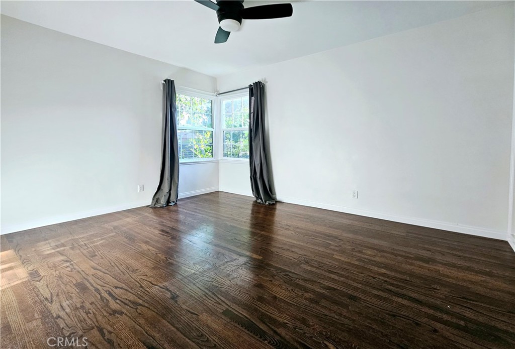 17501 Hamlin Street Lake Balboa, CA 91406 - Photo 15 of 26 a view of empty room with wooden floor and fan