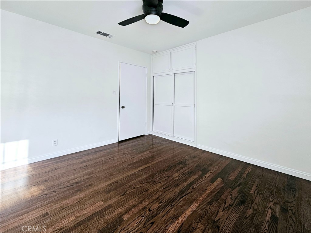 17501 Hamlin Street Lake Balboa, CA 91406 - Photo 18 of 26 wooden floor in an empty room