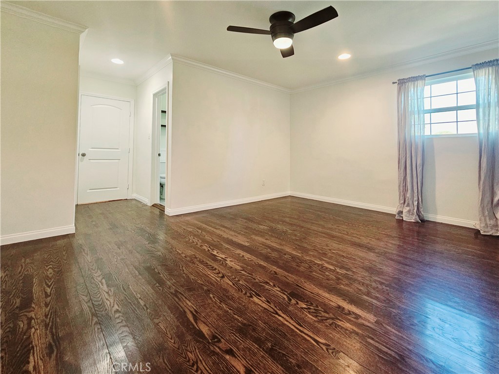 17501 Hamlin Street Lake Balboa, CA 91406 - Photo 19 of 26 an empty room with wooden floor and windows