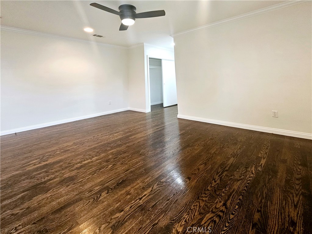 17501 Hamlin Street Lake Balboa, CA 91406 - Photo 20 of 26 an empty room with wooden floor and windows