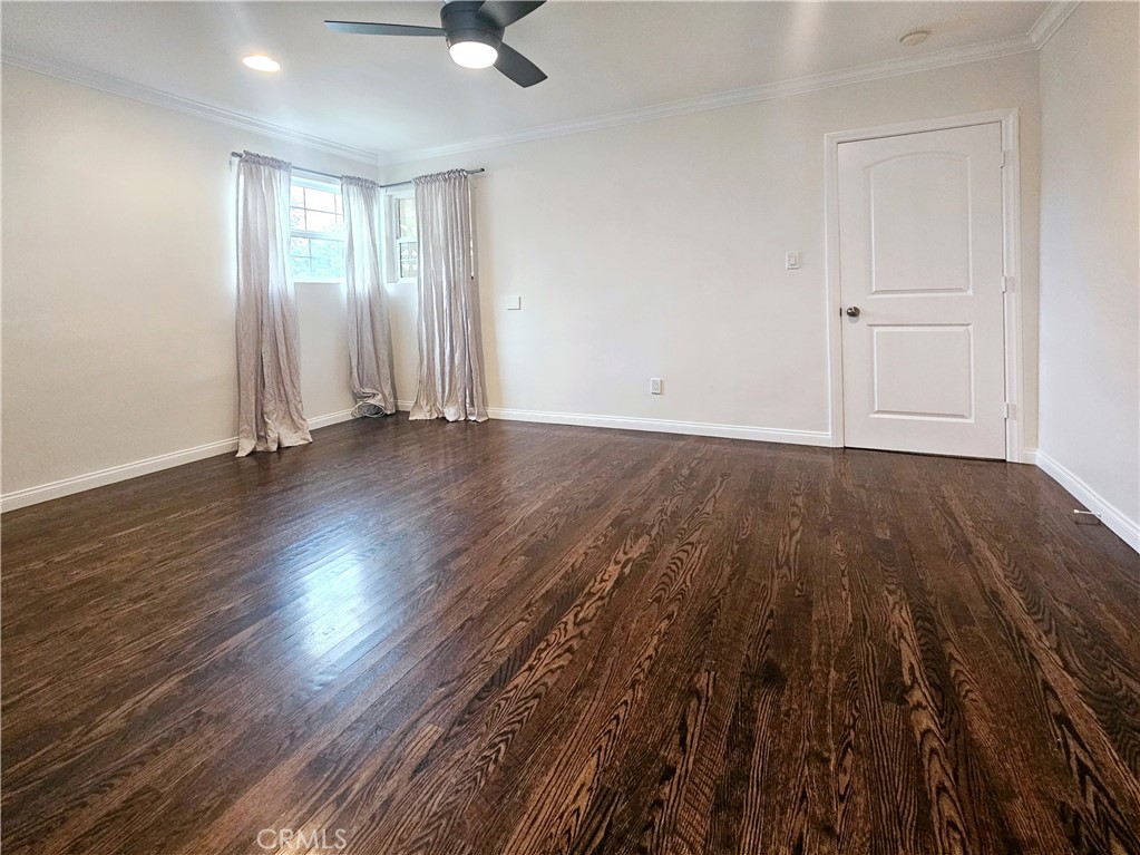 17501 Hamlin Street Lake Balboa, CA 91406 - Photo 21 of 26 wooden floor in an empty room with a window