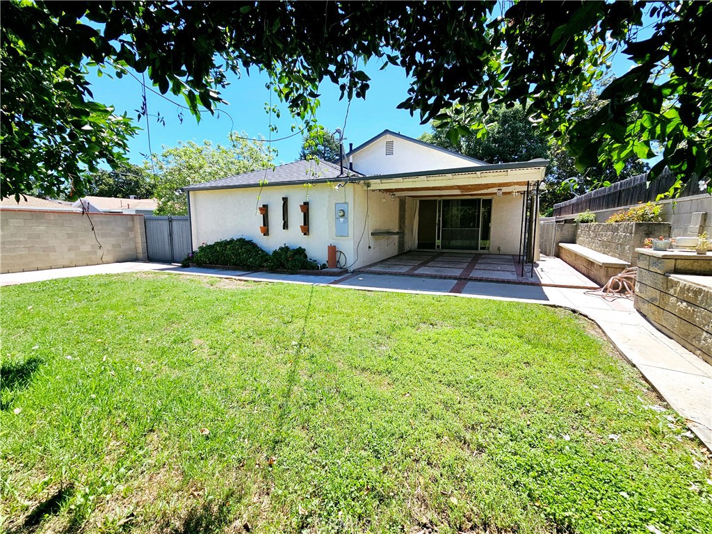 17501 Hamlin Street Lake Balboa, CA 91406 - Photo 25 of 26 a view of a house with a yard and sitting area