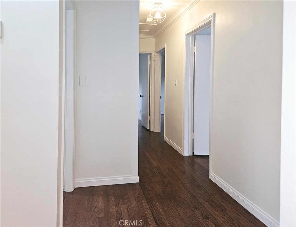 17501 Hamlin Street Lake Balboa, CA 91406 - Photo 4 of 26 a view of a hallway with wooden floor