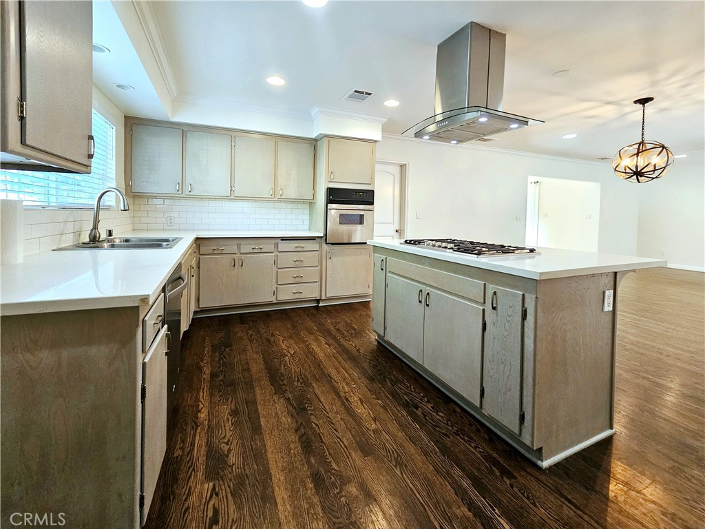 17501 Hamlin Street Lake Balboa, CA 91406 - Photo 5 of 26 a kitchen with a stove a sink and a refrigerator