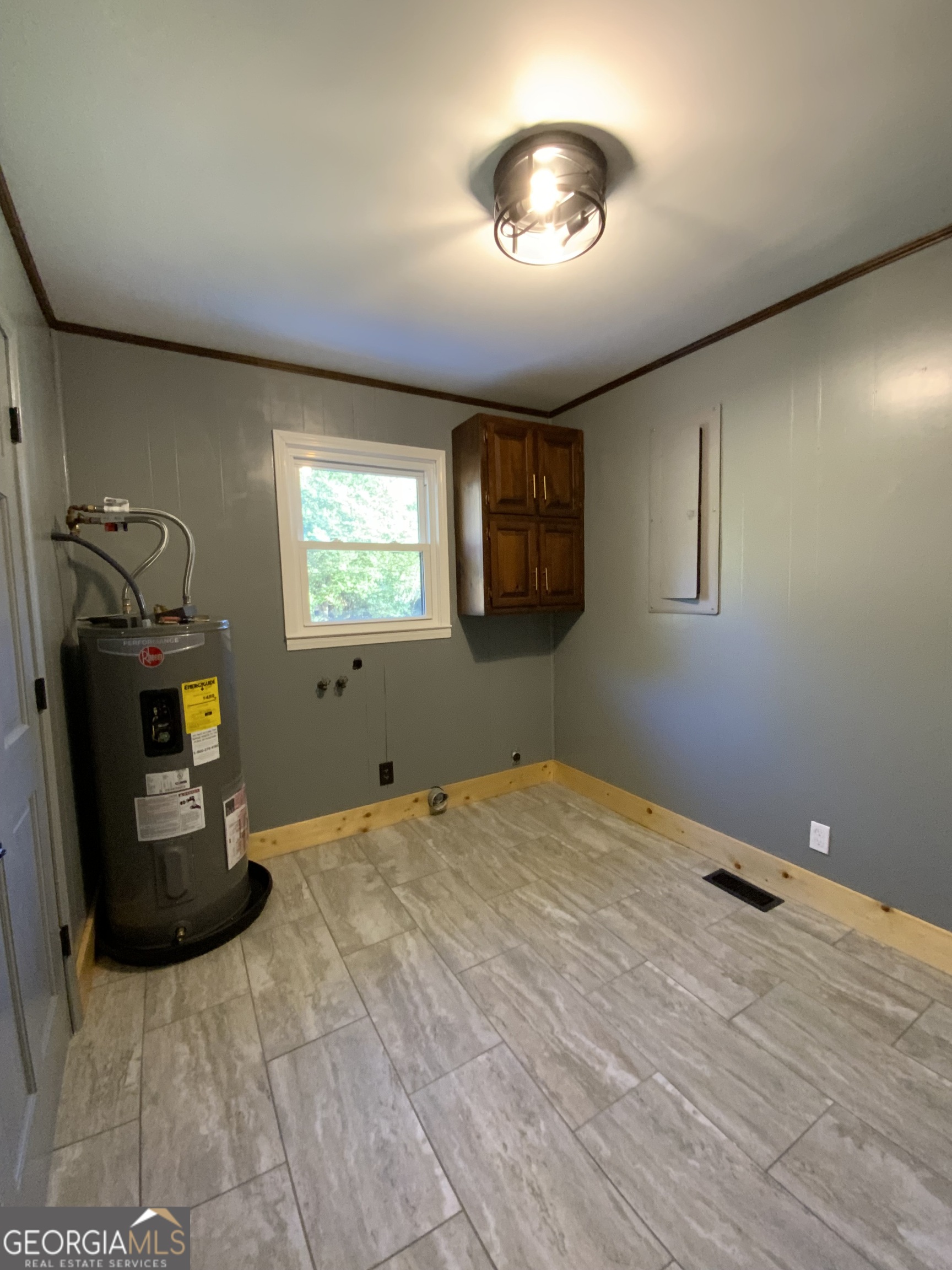 5569 Fosters Mill Road Cave Spring, GA 30124 - Photo 11 of 19 a view of empty room with a fireplace and fan