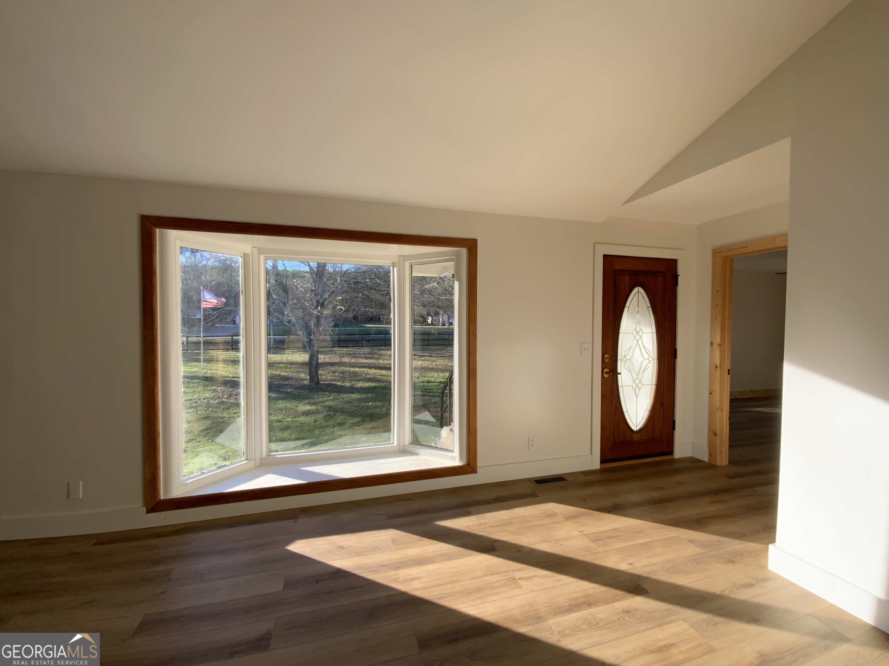 5569 Fosters Mill Road Cave Spring, GA 30124 - Photo 12 of 19 a front view of a house with wooden floor and a window