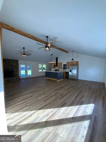 a view of living room with furniture and chandelier