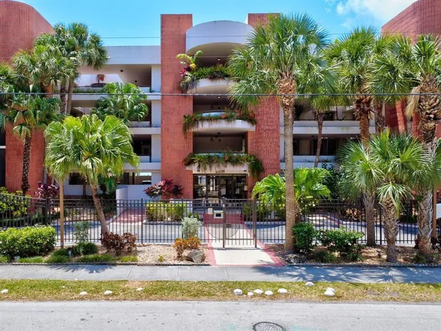 a front view of a house with sitting area