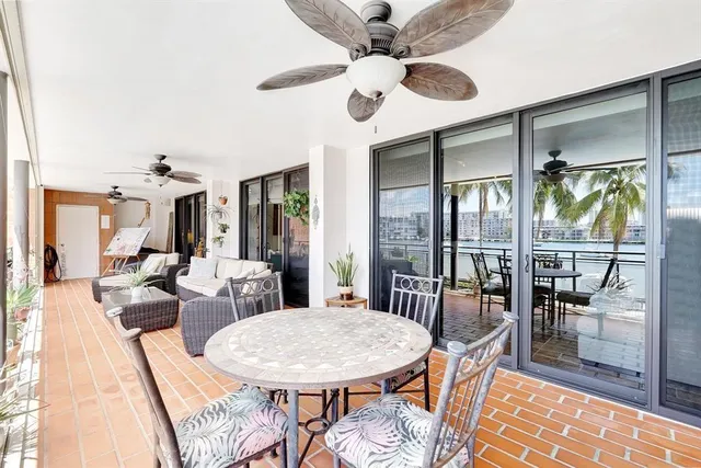 a view of a house with swimming pool and sitting area