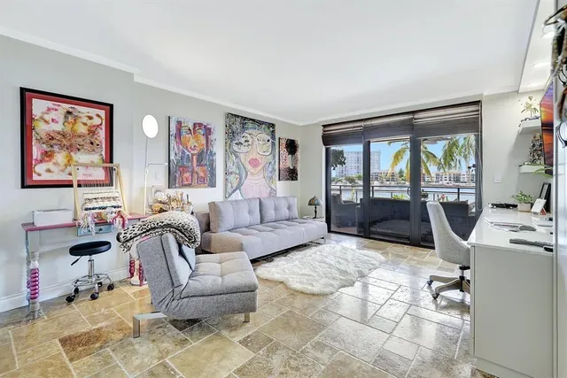 a bed room with furniture and a flat screen tv