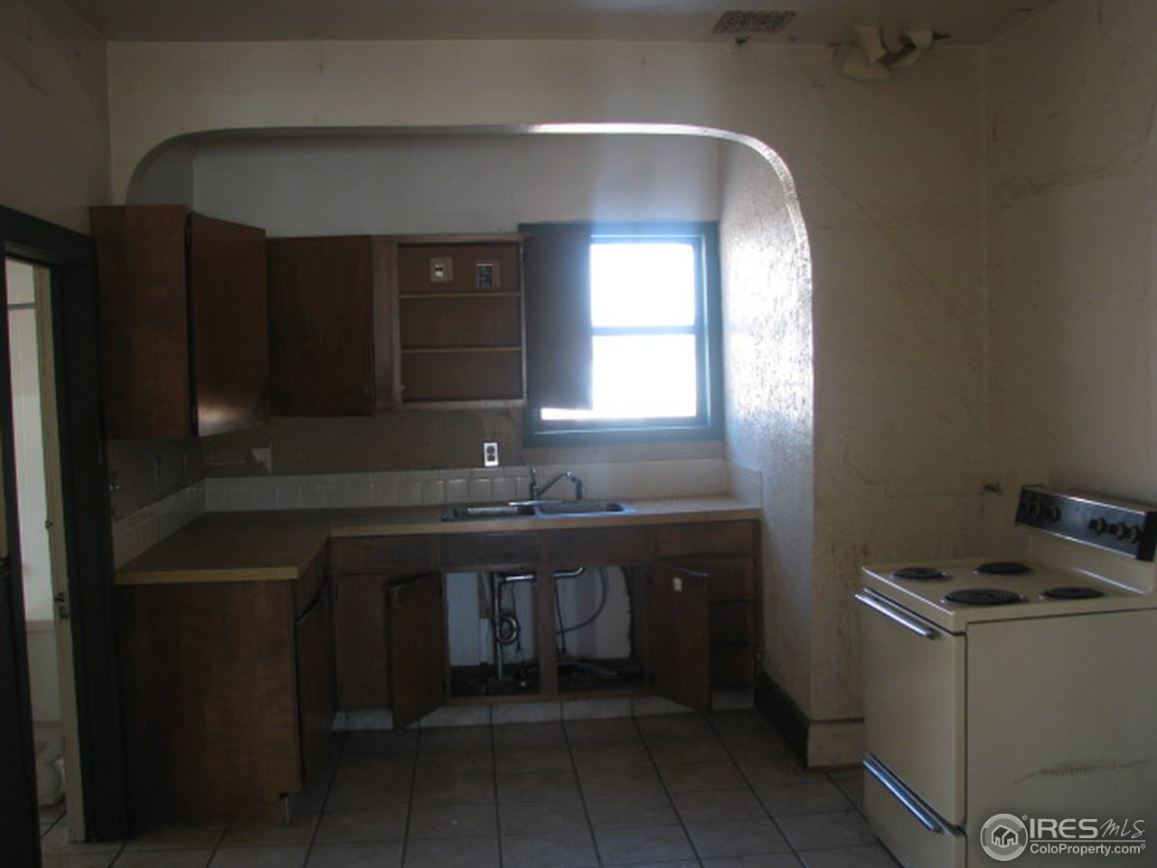 8381 East County Line Road Longmont, CO 80504 - Photo 13 of 18 a kitchen with sink and cabinets