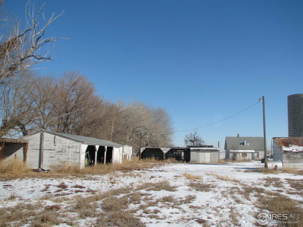 8381 East County Line Road Longmont, CO 80504 - Photo 8 of 18 a view of a dirt road with a building in the background