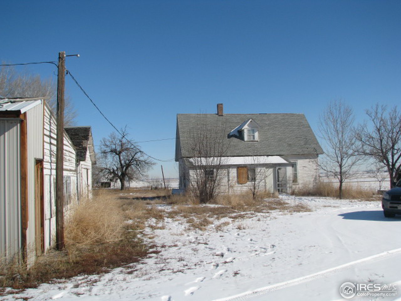 8381 East County Line Road Longmont, CO 80504 - Photo 10 of 18 a view of a house with a snow on the wall