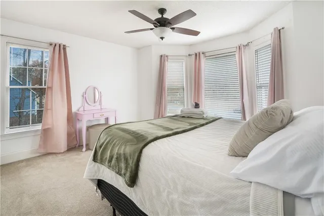 a bedroom with a bed and with the wall painting