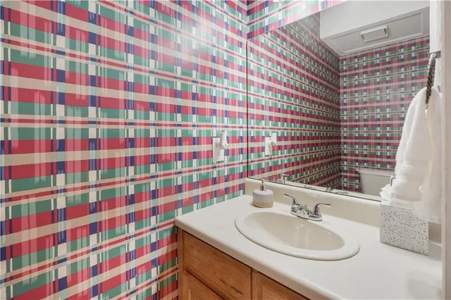 a view of staircase with wooden floor and a rug