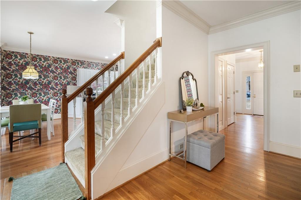 224 Rolling Oaks Drive Rome, GA 30165 - Photo 24 of 55 a view of staircase with wooden floor and a rug