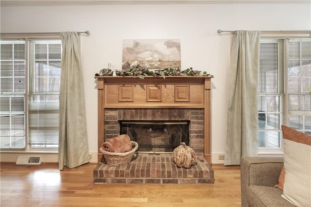 224 Rolling Oaks Drive Rome, GA 30165 - Photo 28 of 55 a living room with furniture and a fireplace