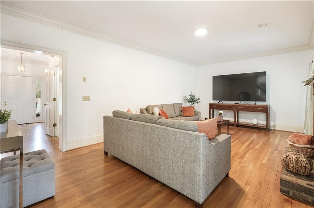 224 Rolling Oaks Drive Rome, GA 30165 - Photo 30 of 55 a living room with furniture and a flat screen tv